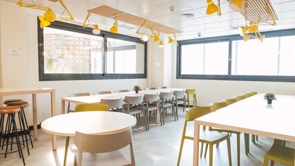 Interior of spacious bright modern canteen in creative office