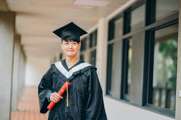 An asian university student wearing graduation gown, gazing into the camera, radiating youthfulness...