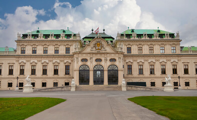 Belvedere Palace Austria, landmark attraction with ornate facade, fountains, statues and reflection pool