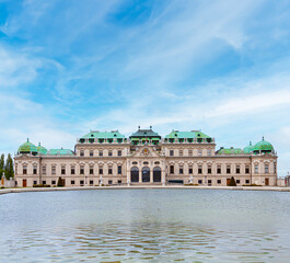 Fototapeta na wymiar Belvedere Palace Austria, landmark attraction with ornate facade, fountains, statues and reflection pool