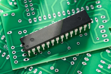 Electronic chip component, integrated circuit in DIP package on the printed circuit board. Through-hole technology.