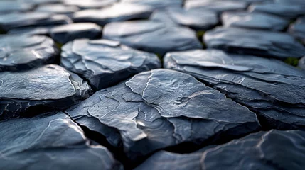 Foto auf Alu-Dibond   A tight shot of a collection of rocks resembling black volcanic stone © Jevjenijs