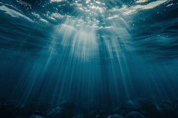 Fototapeta premium Dark blue ocean surface. view from under water. rays of sun break through the thick water. generative ai