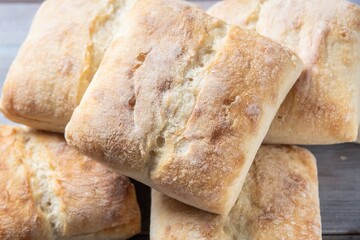 Rustic Elegance: Organic Ciabatta Bread Bun on Wooden Surface in 4K Photo