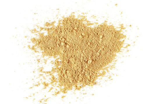 Pile ginger powder isolated on white, top view