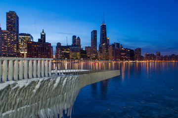 Fototapeta na wymiar Beautiful view of Chicago skyline with light on frozen Lake Michigan