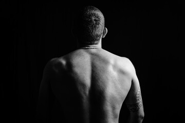 Male body close-up masculinity relief muscles man black and white back rear view
