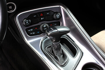 Supercharged muscle car Automatic gearbox lever. Automatic gear stick inside modern car. Detail on...