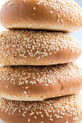 Wholesome Delight: Sesame Seeds Whole Wheat Bagel on White Background in 4K Photo