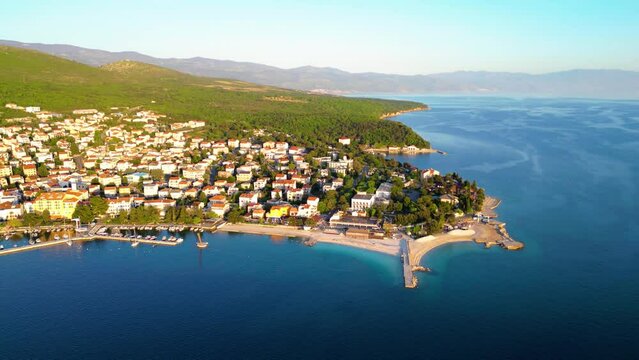 Selce is a picturesque coastal village nestled along the Adriatic Sea in Croatia, renowned for its stunning beaches, charming promenade, and relaxed atmosphere captured  by drone