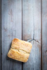 Rustic Elegance: Organic Ciabatta Bread Bun on Wooden Surface in 4K Photo
