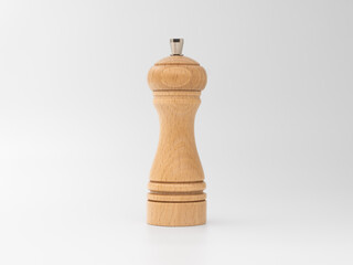 Salt or pepper mill out off beech wood isolated on white. Natural material grinder for a kitchen at...