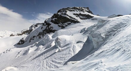 Skiing through a glacier with serac. Skiing down from Piz Palü Switzerland over the glacier to...
