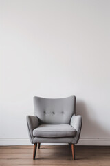 Minimalist modern grey armchair against a white wall, Scandinavian interior design.