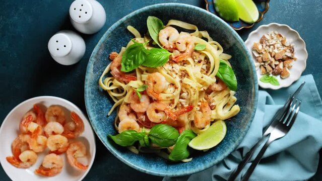 Pasta with shrimps and basil, noodle with shrimps, tagliatelle with seafood. Stock footage video 4k