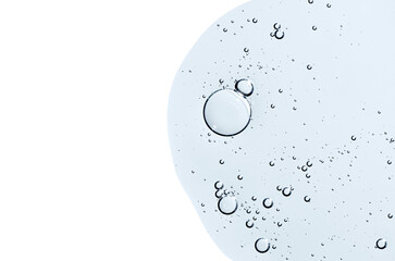 The texture of a body serum or cosmetic oil with bubbles. Liquid skin care product. Copy space.