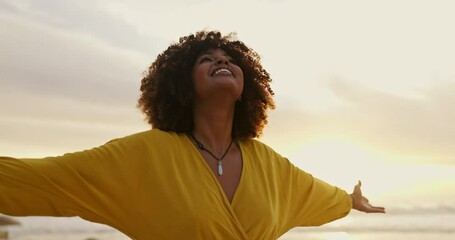 Black woman, sunset and beach with breeze or freedom for travel, holiday and vacation. Female person, sunrise and ocean with fresh air for calm, happiness and peace after new years eve celebration - Powered by Adobe
