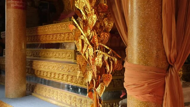 decor with golden leaves in a Buddhist temple