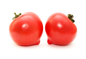 Round Pink tomato with a nose that produces heart shape when cut in half - 784489263