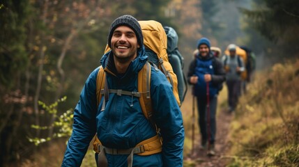 Happy backpacker and his friends hiking in forest - obrazy, fototapety, plakaty
