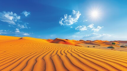 Naklejka premium sun shines over sand dunes, blue sky with wispy clouds