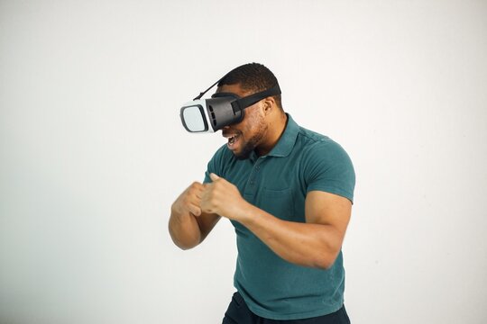 Fototapeta Black guy with virtual reality glasses isolated on white background