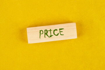 Price word on wooden blocks on a yellow background