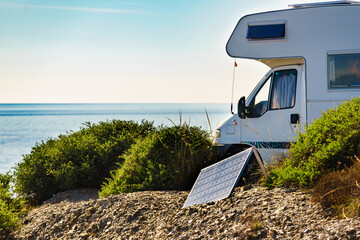 Caravan camp on seahore with portable solar panel - 784507249