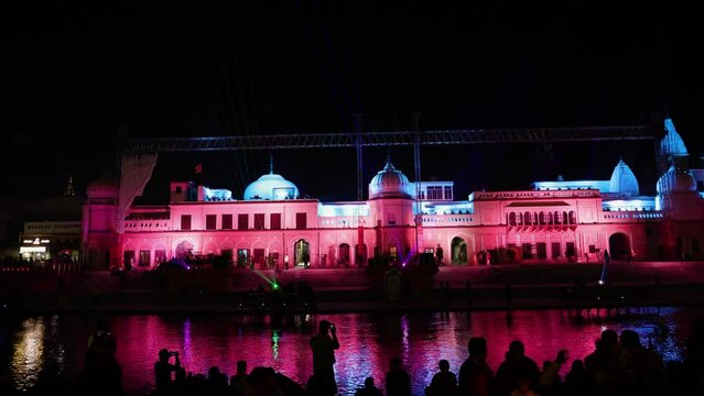 Stunning laser light show at temple wall at night from different angle