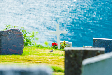 Churchyard in Nes village at fjord, Norway - 784512089