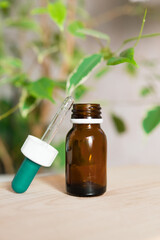 Opened brown dropper glass bottle with pipette. Serum, acid, oil. Spa, beauty, skincare product. Organic, natural cosmetic.