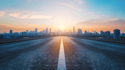 An empty asphalt road extends into a modern city skyline at sunset, offering a high-angle view that captures the urban scenery in a tranquil moment - obrazy, fototapety, plakaty