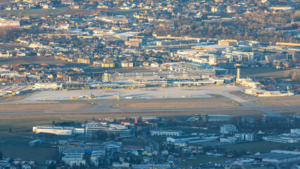 Salzburg Airport seen from the Gaisberg mountain summit in early morning