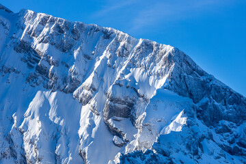 Steep mountain cliffs with snow and ice