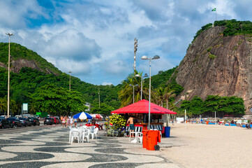 Copacabana and Leme beaches with kiosk and mosaic of sidewalk in Rio de Janeiro, Brazil. Copacabana beach is the most famous beach in Rio de Janeiro. Sunny cityscape of Rio de Janeiro
