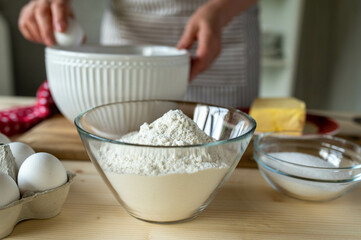 Bowl with flour on kitchen table for baking ingredient