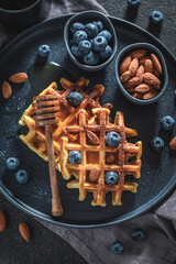 Delicious dark waffles made of berries, almonds and cocoa.