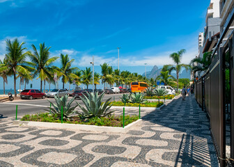 Ipanema with mosaic of sidewalk in Rio de Janeiro, Brazil. Ipanema beach is the most famous beach of Rio de Janeiro, Brazil. Cityscape of Rio de Janeiro.