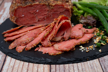 Vegan mock meat, made of wheat gluten, plant based. Steamed, roasted and sliced