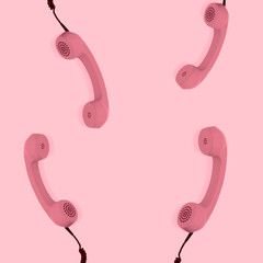 Pink retro phone handsets on pink background. Concept 80s or 90s retro fashion telephone.
