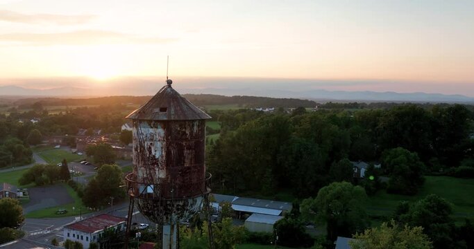 Orange Virginia water tower at sunset