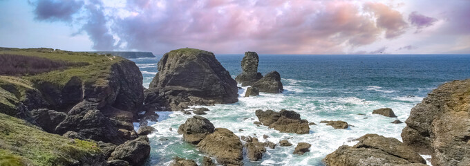 Naklejka premium Belle-Ile in Brittany, seascape with rocks and cliffs on the Cote Sauvage, the needles of Port-Coton 