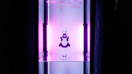 Anime figure maid girl inside the glass cabinet with pink backlight