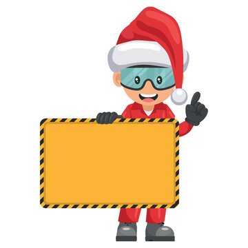 Industrial mechanic worker with Santa Claus hat holding a banner with space for text for advertising, presentations, brochures. Merry christmas. Industrial safety and occupational health at work
