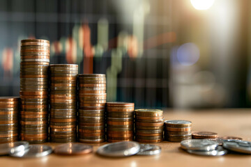 Concept of return on investment with a graph showing upward growth and a stack of coins increasing in height