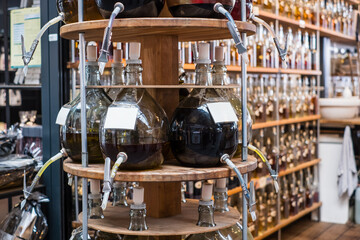 Olive oils and balsamic vinegars in large glass containers with a tap. Specialty store for culinary...