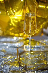 Close up of shiny glass of champagne over party background