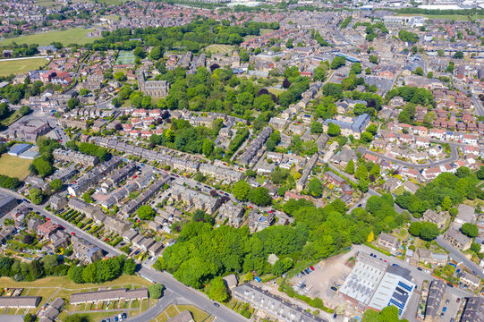 Aerial photo of the village of Pudsey in Leeds West Yorkshire in the UK, showing a typical British streets and houses, church and roads taken with a drone on a sunny summers day