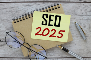 Business concept. note paper with text. text SEO 2025 Business concept.