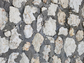 Texture of a limestone wall built against sea waves in the Eastern Mediterranean